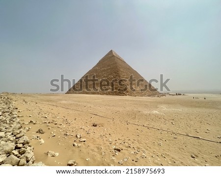 The Great Pyramid of Giza is the largest Egyptian pyramid and tomb of the Fourth Dynasty pharaoh Khufu. Built in the 26th century BC, it is the oldest of the Seven Wonders of the Ancient World. Royalty-Free Stock Photo #2158975693