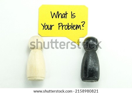 two wooden peg dolls and a conversation box with the word or question what is your problem Concept