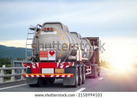 Trucks transporting dangerous chemical on the road Royalty-Free Stock Photo #2158994103