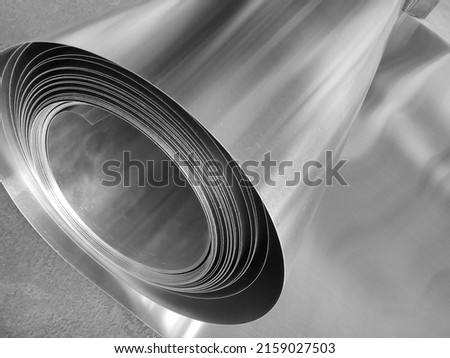 one roll of aluminum metal material in industrial room Royalty-Free Stock Photo #2159027503