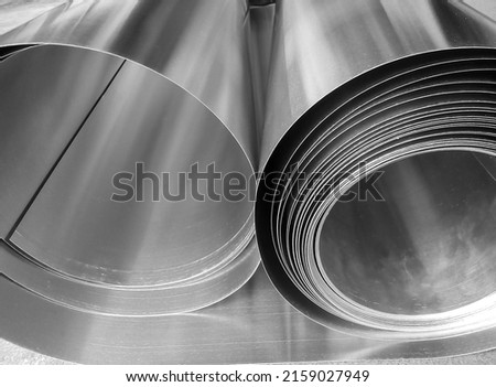 two rolls of aluminum metal material in industrial room Royalty-Free Stock Photo #2159027949