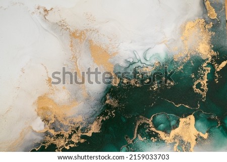 Marble ink abstract art from exquisite original painting for abstract background . Painting was painted on high quality paper texture to create smooth marble background pattern of ombre alcohol ink . Royalty-Free Stock Photo #2159033703