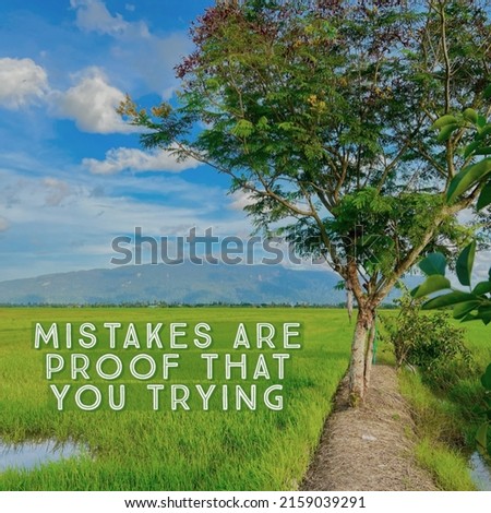 Inspirational and motivational quote on paddy field and mountain background, Mistakes Are Proof That You Trying, selective focus.