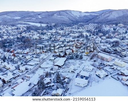 An aerial shot of Ilsenburg in winter on a sunny day in Harz, Saxony-Anhalt,Germany