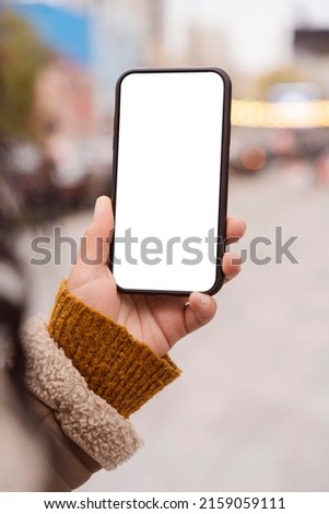 woman holding blank smartphone mockup 