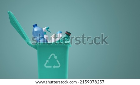 Recycling bin full of plastic waste, separate waste collection concept Royalty-Free Stock Photo #2159078257