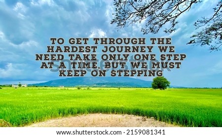 Inspirational and motivational quote on paddy field and mountain background, To Get Through The Hardest Journey We Need Take Only One Step At The Time, But We Must Keep On Stepping, selective focus.