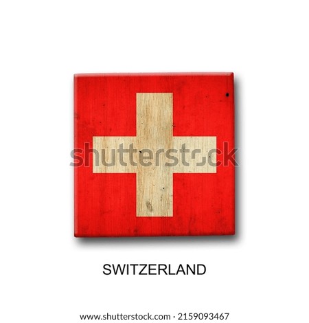 Switzerland flag on a wooden block. Isolated on white background. Signs and symbols. Flags.