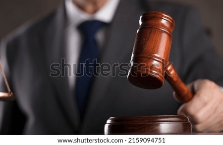 Judge striking gavel. Courtroom concept.