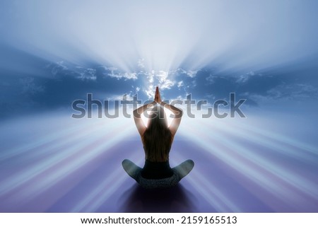 Woman with yoga pose front sky Royalty-Free Stock Photo #2159165513