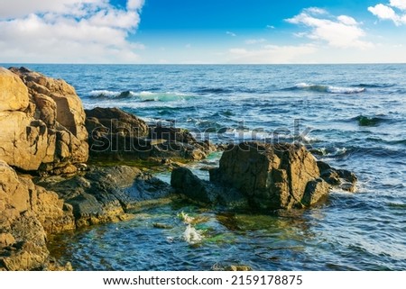 stones and rock at the sea. beautiful nature background with calm water in morning light