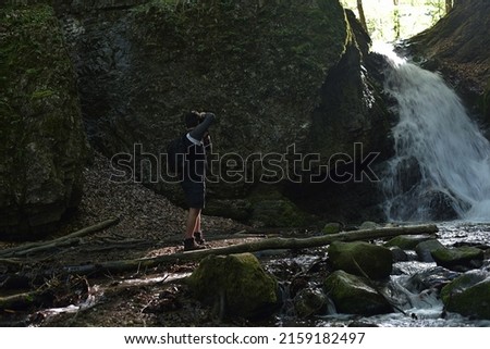  man takes pictures in the creek bed in the gorge