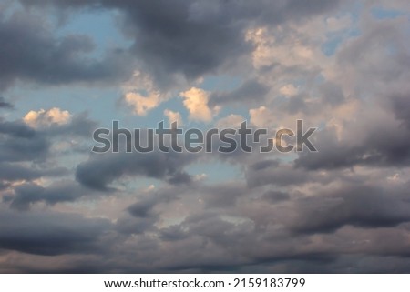 Summer cloudy blue sky background. Panoramic view with beautiful clouds. Horizontal cloudscape. High-resolution photography. Design element. Copy space.