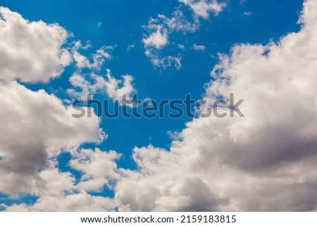 Summer cloudy blue sky background. Horizontal cloudscape. High-resolution photography. Design element. Copy space.