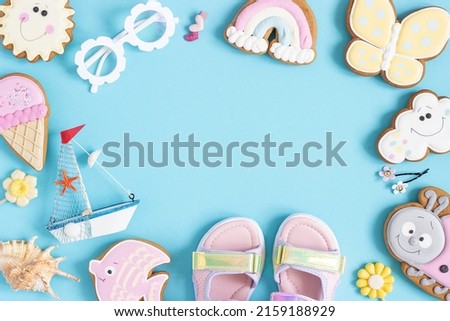 Bright creative layout made of cute summer symbols with copy space on blue background. Top view, Flat lay. Creative summer concept.