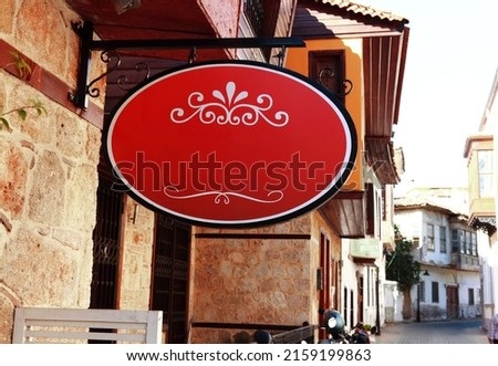Royalty free photo of blank red wrought iron sign in Kaleici, Antalya.
