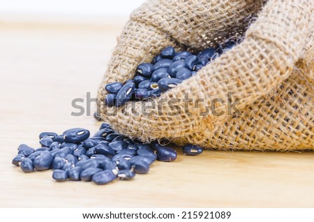 stilllife picture of nuts beans on wooden floor