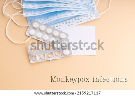 Medical supplies on a blue background. Monkeypox infections concept.