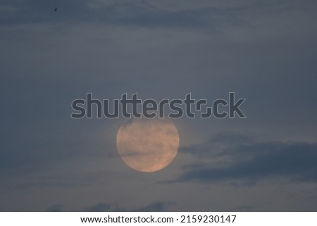 Full moon background in the midnight Thailand.moon and cloud nature background.Black night and full moon,Big lunar on the sky.