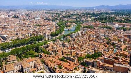 Aerial view of Trastevere district and Tiber Island, the only river island in the part of the Tiber which runs through Rome, Italy. In the period of ancient Rome, the temple of Asclepius stood here Royalty-Free Stock Photo #2159233587