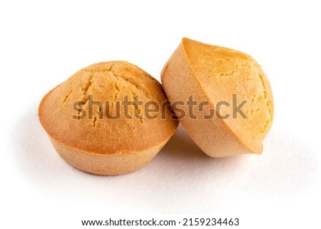 Two homemade rice muffins on a white isolated background. Rice flour cupcakes. Breakfast with a gluten-free diet. Proper nutrition. Template, design.