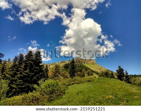 Beautiful blue sky and clouds in the mountains of Panorama Trail in Borjomi-Kharagauli National Park, Georgia, Caucasus