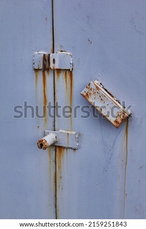 rusty old metal door with lock