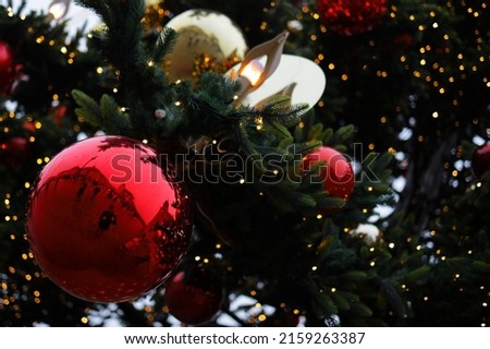 A closeup of decorations on a Christmas tree