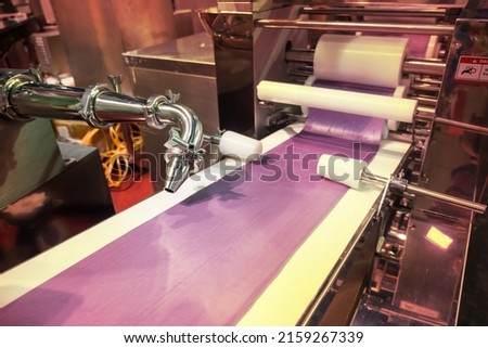 Automatic stuffed dumpling making machine with conveyor line system.