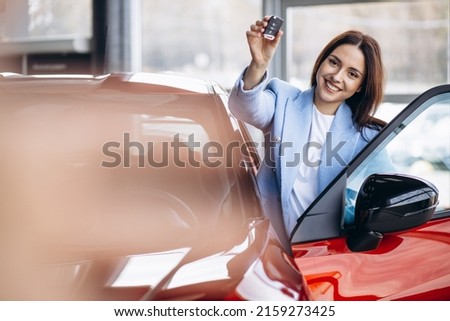 Young woman holding car keys Royalty-Free Stock Photo #2159273425