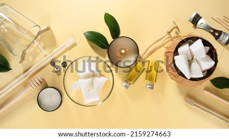 Set for homemade natural eco-friendly coconut wax candles, wick, perfume, aroma oil. Candle making utensils.Trendy diy candles to health on beige background.Copy space.Cruelty-free vegan product Royalty-Free Stock Photo #2159274663