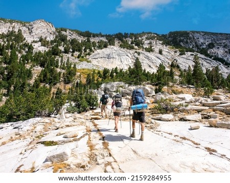 A group of backpackers hiking the John Muir Trail in the Sierra Nevada Mountains of California Royalty-Free Stock Photo #2159284955