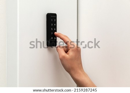 Digital Door Key or Electronic Key System, Keypad lock on Wooden Door for access to room security Royalty-Free Stock Photo #2159287245