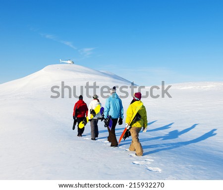 Group of snowboarders enjoying a beautiful Winter morning. Royalty-Free Stock Photo #215932270