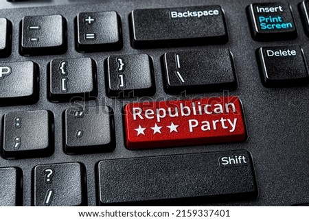 Republican Party red key on a decktop computer keyboard. Concept of voting online for Republican Party, politics, United States elections. Laptop enter key with Republican Party word message. Top view Royalty-Free Stock Photo #2159337401