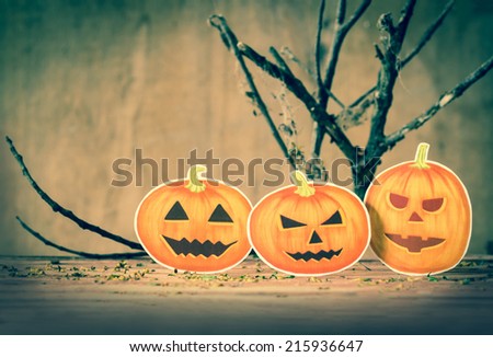 Happy Halloween pumpkin on wood.