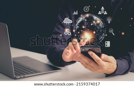 Businessman using smartphone connection with computer, connection network wireless devices, digital hologram technology and internet of things, big data, cloud storage management concept