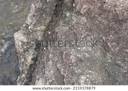wind stone background. erosion creates a beautiful pattern beside the river.