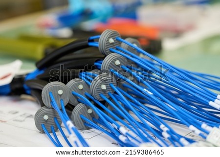 Wire being processed for wiring to a machine