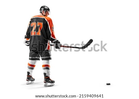 Hockey. Sport concept. Professional hockey player isolated on white background. Athlete. View from behind