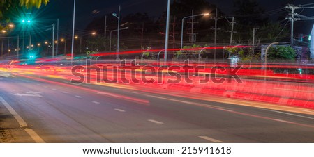 Long exposure photo of light trails on the street in Thailand.