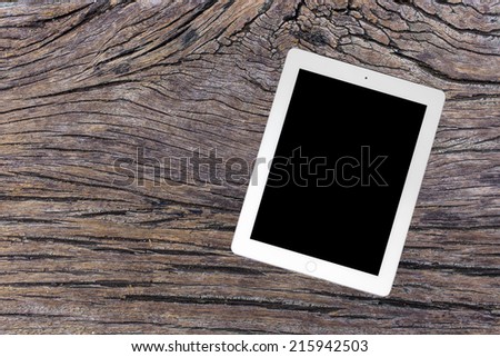 empty tablet on wooden background