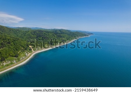 The Zubova Schel Viaduct is a road bridge, Dzhubga - Adler federal road. Aerial view of car driving along the winding mountain road in Sochi, Russia. Royalty-Free Stock Photo #2159438649