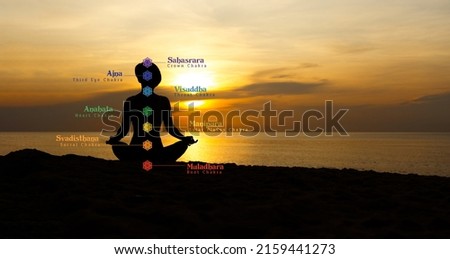 Yoga chakras info banner poster, Silhouette of healthy and beautiful woman siiting in asana poses with sunrise on twilight blue vibrant sky and calm sea in background with graphic letters. Backdrop.