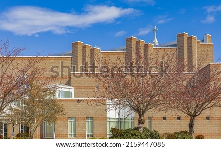Modern Contemporary Church on the blue sky background. Street view, selective focus, nobody