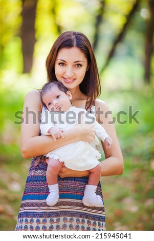 Mother with newborn baby at outdoors