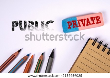 Private and Public. Eraser and pencils on the office desk.