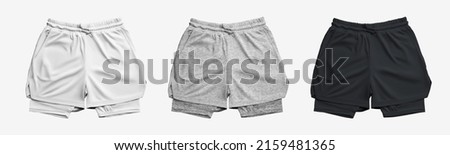 Mockup of men's sports shorts with compression fittings. White, black and heather sportswear. Top View. Set Royalty-Free Stock Photo #2159481365