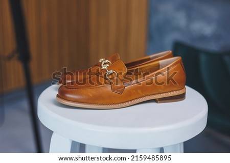 Vintage Women's Loafer Shoes. Closeup. Advertising shot. Leather brown shoes. Concept closeup shoes. Isolated object close up on white background. Back shoe view. Royalty-Free Stock Photo #2159485895