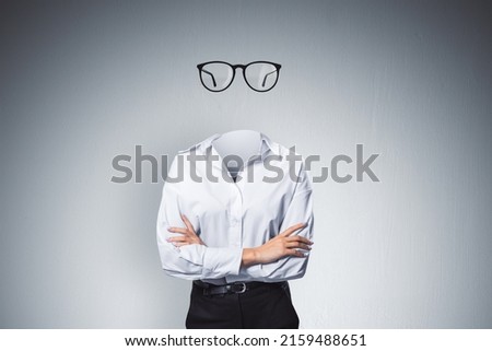 Headless invisible businesswoman with folded arms and abstract glasses standing on gray wall background. Business and secret concept